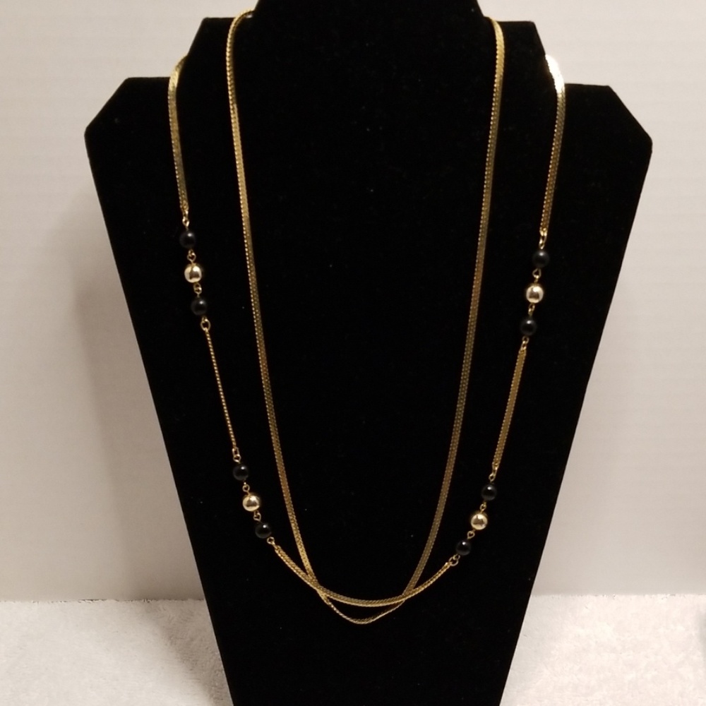 Gold color necklace with some beads